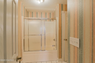 Opportunity knocks with this 1-bedroom condo in a gated golf on Brunswick Plantation and Golf Resorts in North Carolina - for sale on GolfHomes.com, golf home, golf lot