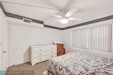 Ready to retire or just enjoy a nice vacation? Welcome to on Wynmoor Golf Course in Florida - for sale on GolfHomes.com, golf home, golf lot
