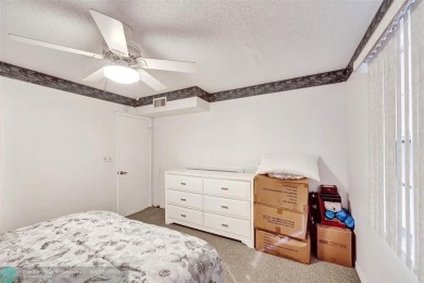 Ready to retire or just enjoy a nice vacation? Welcome to on Wynmoor Golf Course in Florida - for sale on GolfHomes.com, golf home, golf lot