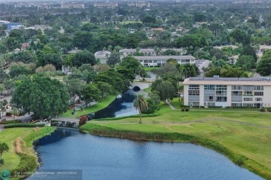 Ready to retire or just enjoy a nice vacation? Welcome to on Wynmoor Golf Course in Florida - for sale on GolfHomes.com, golf home, golf lot