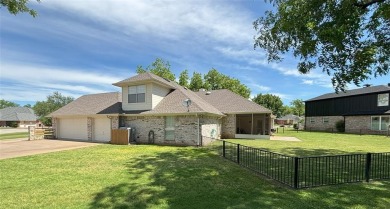 This beautiful  IMMACULATE home is located on the corner of a on Pecan Plantation Country Club in Texas - for sale on GolfHomes.com, golf home, golf lot