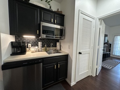 Walk-In Golf front condo with a pond view located  at on Ledgestone Country Club and Golf Course in Missouri - for sale on GolfHomes.com, golf home, golf lot