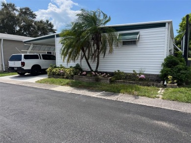 Experience the ideal lifestyle in this captivating home located on Palm Hill Golf Club in Florida - for sale on GolfHomes.com, golf home, golf lot