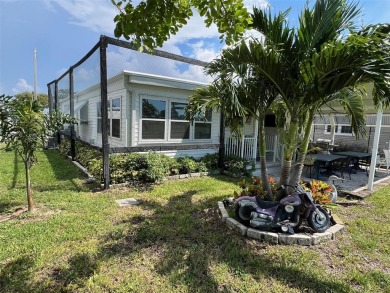 Experience the ideal lifestyle in this captivating home located on Palm Hill Golf Club in Florida - for sale on GolfHomes.com, golf home, golf lot