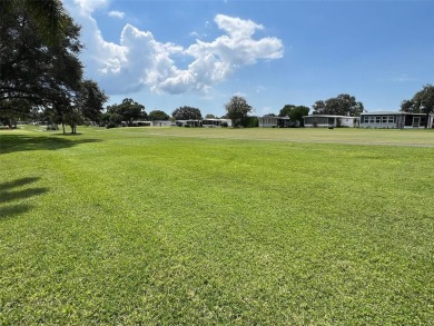 Experience the ideal lifestyle in this captivating home located on Palm Hill Golf Club in Florida - for sale on GolfHomes.com, golf home, golf lot