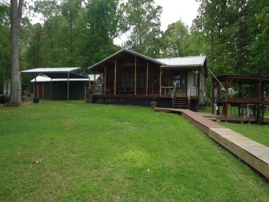 This spotless Waterfront Home on Toledo Bend is located across on Cypress Bend Golf Course in Texas - for sale on GolfHomes.com, golf home, golf lot