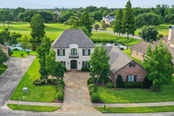 Perfectly situated over looking the pond and golf course, this on LeTriomphe Golf & Country Club in Louisiana - for sale on GolfHomes.com, golf home, golf lot