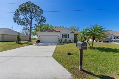 Welcome to this charming three-bedroom, two-bathroom home with a on Deep Creek Golf Club in Florida - for sale on GolfHomes.com, golf home, golf lot