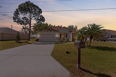 Welcome to this charming three-bedroom, two-bathroom home with a on Deep Creek Golf Club in Florida - for sale on GolfHomes.com, golf home, golf lot