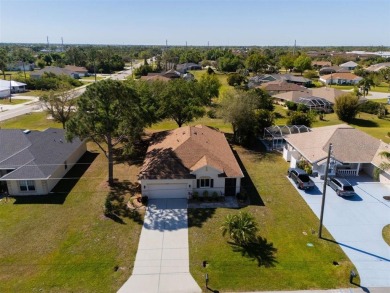 Welcome to this charming three-bedroom, two-bathroom home with a on Deep Creek Golf Club in Florida - for sale on GolfHomes.com, golf home, golf lot