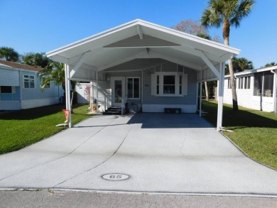 This is a wonderful 1 Bedroom 1 Bath and Bonus Room with laundry on The Great Outdoors Golf and Country Club in Florida - for sale on GolfHomes.com, golf home, golf lot