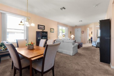 Welcome to this charming three-bedroom, two-bathroom home with a on Deep Creek Golf Club in Florida - for sale on GolfHomes.com, golf home, golf lot