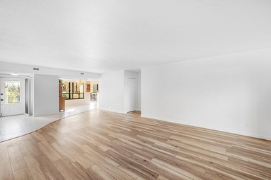 Serene golf course and pond views enhance this first-floor on Quail Ridge Golf Course and Country Club in Florida - for sale on GolfHomes.com, golf home, golf lot