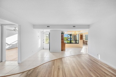 Serene golf course and pond views enhance this first-floor on Quail Ridge Golf Course and Country Club in Florida - for sale on GolfHomes.com, golf home, golf lot