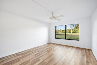 Serene golf course and pond views enhance this first-floor on Quail Ridge Golf Course and Country Club in Florida - for sale on GolfHomes.com, golf home, golf lot