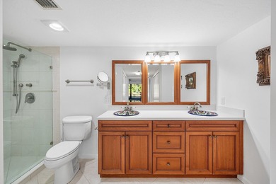 Serene golf course and pond views enhance this first-floor on Quail Ridge Golf Course and Country Club in Florida - for sale on GolfHomes.com, golf home, golf lot