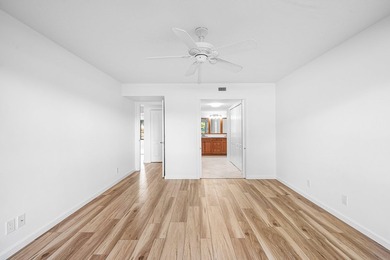 Serene golf course and pond views enhance this first-floor on Quail Ridge Golf Course and Country Club in Florida - for sale on GolfHomes.com, golf home, golf lot