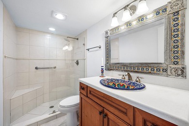 Serene golf course and pond views enhance this first-floor on Quail Ridge Golf Course and Country Club in Florida - for sale on GolfHomes.com, golf home, golf lot