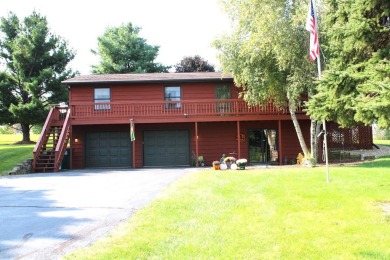 Welcome to this 3 bedroom, 3 bath live edge cedar sided home on Lake Carroll Golf Course in Illinois - for sale on GolfHomes.com, golf home, golf lot