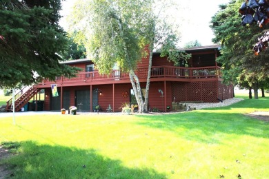 Welcome to this 3 bedroom, 3 bath live edge cedar sided home on Lake Carroll Golf Course in Illinois - for sale on GolfHomes.com, golf home, golf lot