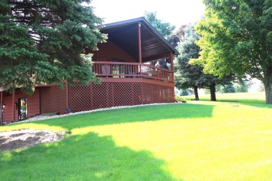 Welcome to this 3 bedroom, 3 bath live edge cedar sided home on Lake Carroll Golf Course in Illinois - for sale on GolfHomes.com, golf home, golf lot