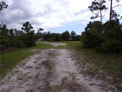 Pondfront Lot in Tropical Gulf Acres. Enjoy peaceful water views on Seminole Lakes Country Club in Florida - for sale on GolfHomes.com, golf home, golf lot