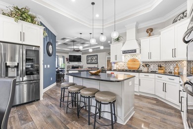 Welcome to this stunning custom-built 2021 stucco home on Wild Wing Plantation in South Carolina - for sale on GolfHomes.com, golf home, golf lot
