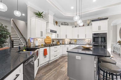 Welcome to this stunning custom-built 2021 stucco home on Wild Wing Plantation in South Carolina - for sale on GolfHomes.com, golf home, golf lot