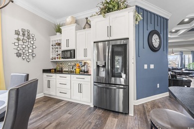 Welcome to this stunning custom-built 2021 stucco home on Wild Wing Plantation in South Carolina - for sale on GolfHomes.com, golf home, golf lot