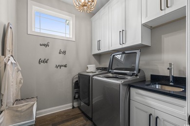 Welcome to this stunning custom-built 2021 stucco home on Wild Wing Plantation in South Carolina - for sale on GolfHomes.com, golf home, golf lot