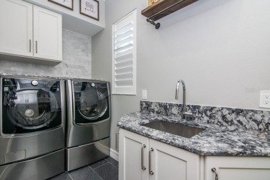 Step into this beautifully renovated 4-bedroom, 3.5-bath home in on Palma Ceia Golf and Country Club in Florida - for sale on GolfHomes.com, golf home, golf lot