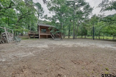 Nestled in the heart of the piney woods, this charming cottage on Holly Lake Ranch Golf Club in Texas - for sale on GolfHomes.com, golf home, golf lot