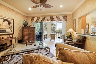 Experience refined coach home living in this beautifully on West Bay Beach and Golf Club in Florida - for sale on GolfHomes.com, golf home, golf lot