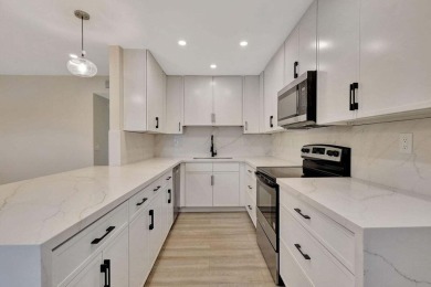 Discover the ultimate in luxury living at 802 Burgundy Q, a on Kings Point Golf -Flanders Way in Florida - for sale on GolfHomes.com, golf home, golf lot