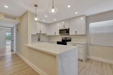 Discover the ultimate in luxury living at 802 Burgundy Q, a on Kings Point Golf -Flanders Way in Florida - for sale on GolfHomes.com, golf home, golf lot