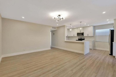 Discover the ultimate in luxury living at 802 Burgundy Q, a on Kings Point Golf -Flanders Way in Florida - for sale on GolfHomes.com, golf home, golf lot