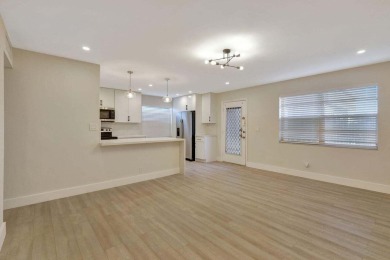 Discover the ultimate in luxury living at 802 Burgundy Q, a on Kings Point Golf -Flanders Way in Florida - for sale on GolfHomes.com, golf home, golf lot