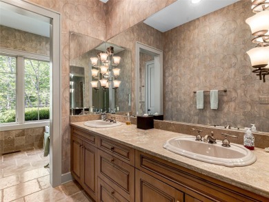 Overlooking the scenic 4th hole, this stunning 4-bedroom, 4 on Lake Toxaway Country Club in North Carolina - for sale on GolfHomes.com, golf home, golf lot