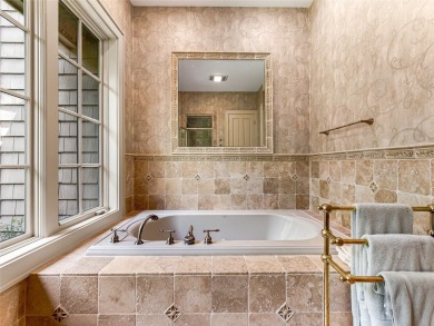 Overlooking the scenic 4th hole, this stunning 4-bedroom, 4 on Lake Toxaway Country Club in North Carolina - for sale on GolfHomes.com, golf home, golf lot