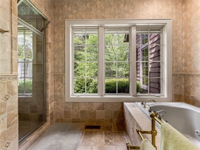 Overlooking the scenic 4th hole, this stunning 4-bedroom, 4 on Lake Toxaway Country Club in North Carolina - for sale on GolfHomes.com, golf home, golf lot