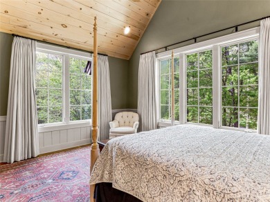 Overlooking the scenic 4th hole, this stunning 4-bedroom, 4 on Lake Toxaway Country Club in North Carolina - for sale on GolfHomes.com, golf home, golf lot