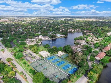All hurricane impact windows, new A/C, hot water heater (2023) on Wynmoor Golf Course in Florida - for sale on GolfHomes.com, golf home, golf lot