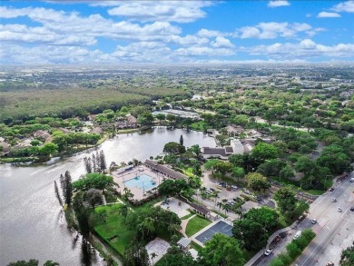 All hurricane impact windows, new A/C, hot water heater (2023) on Wynmoor Golf Course in Florida - for sale on GolfHomes.com, golf home, golf lot