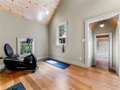 Overlooking the scenic 4th hole, this stunning 4-bedroom, 4 on Lake Toxaway Country Club in North Carolina - for sale on GolfHomes.com, golf home, golf lot