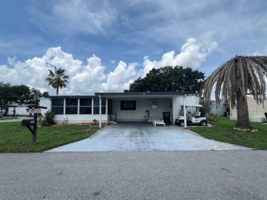 Charming home located in highly sought after Hidden Golf Club on Lake Henry Golf Club in Florida - for sale on GolfHomes.com, golf home, golf lot