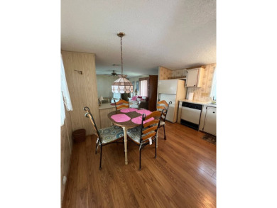 Charming home located in highly sought after Hidden Golf Club on Lake Henry Golf Club in Florida - for sale on GolfHomes.com, golf home, golf lot