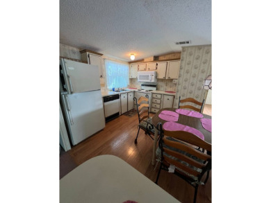 Charming home located in highly sought after Hidden Golf Club on Lake Henry Golf Club in Florida - for sale on GolfHomes.com, golf home, golf lot