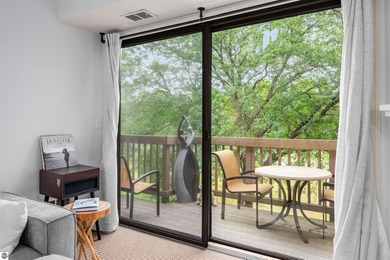 Perched above the third tee of Spruce Run Golf Course, this on Grand Traverse Resort and Spa in Michigan - for sale on GolfHomes.com, golf home, golf lot