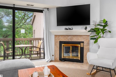 Perched above the third tee of Spruce Run Golf Course, this on Grand Traverse Resort and Spa in Michigan - for sale on GolfHomes.com, golf home, golf lot