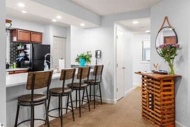 Perched above the third tee of Spruce Run Golf Course, this on Grand Traverse Resort and Spa in Michigan - for sale on GolfHomes.com, golf home, golf lot